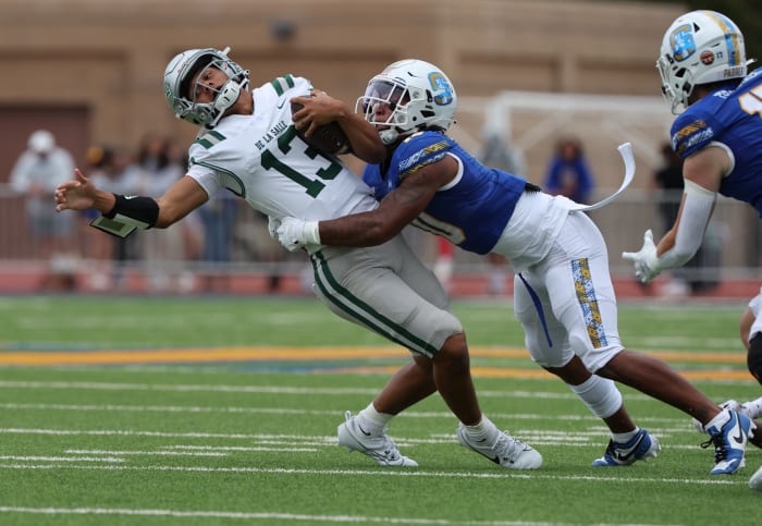 Toa Faavae was pressured and hit hard all afternoon at Brady Family Stadium.